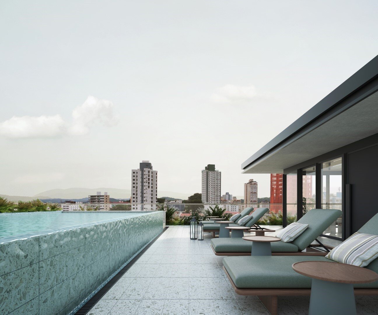 Piscina en azotea con camastros y vista urbana, en Nook Residence.